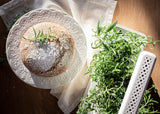 Olive oil cake with fresh rosemary next to the Click & Grow smart garden 3